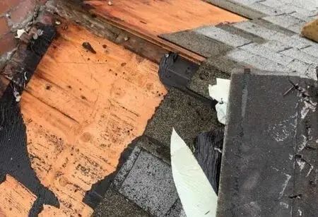 Roofer performing roof repair on a Connecticut home